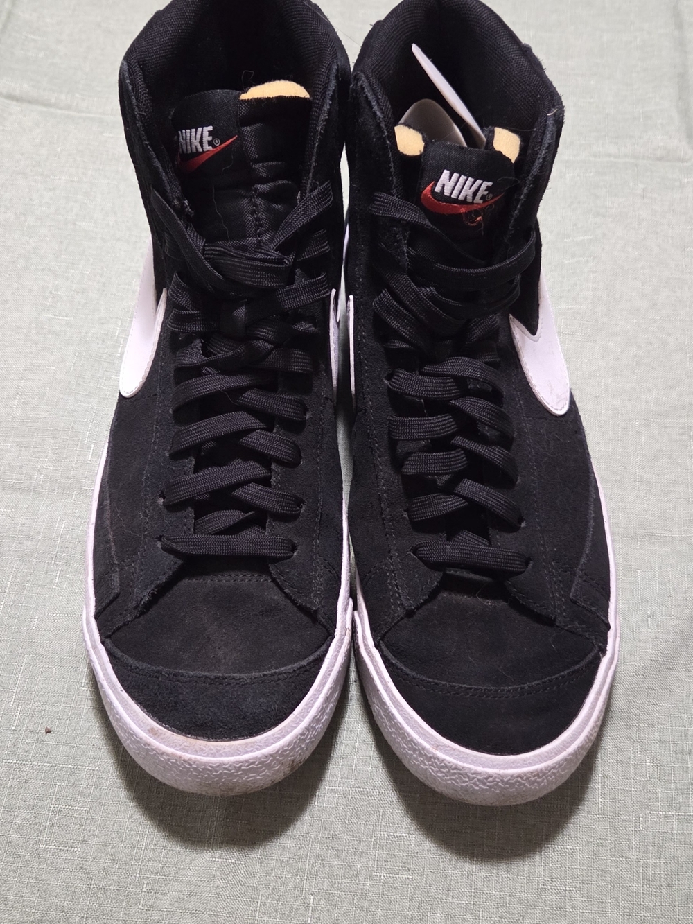 Nike Black and White High-Top Sneakers with Red Logo